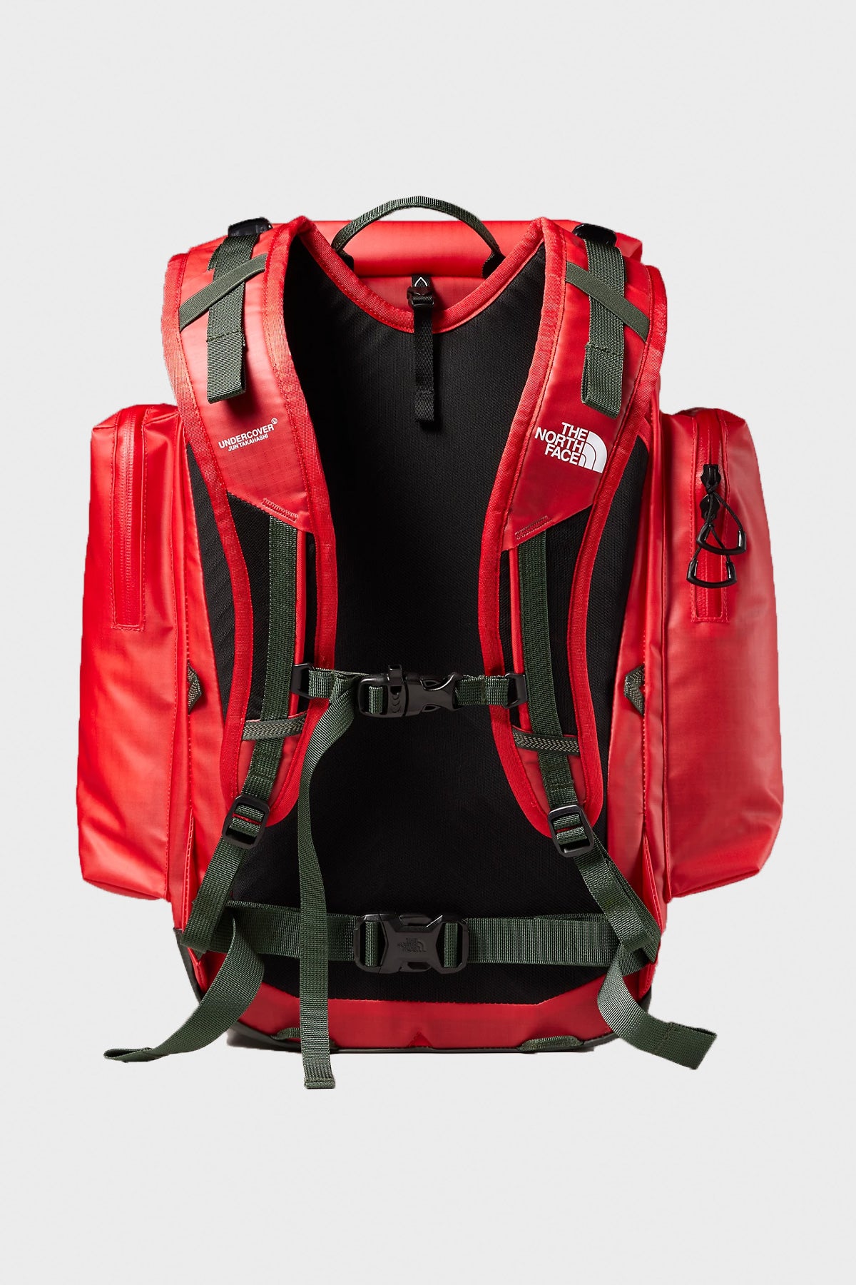 The North Face - TNF x Undercover Soukuu Backpack - Dark Cedar Green/High Risk Red - Canoe Club