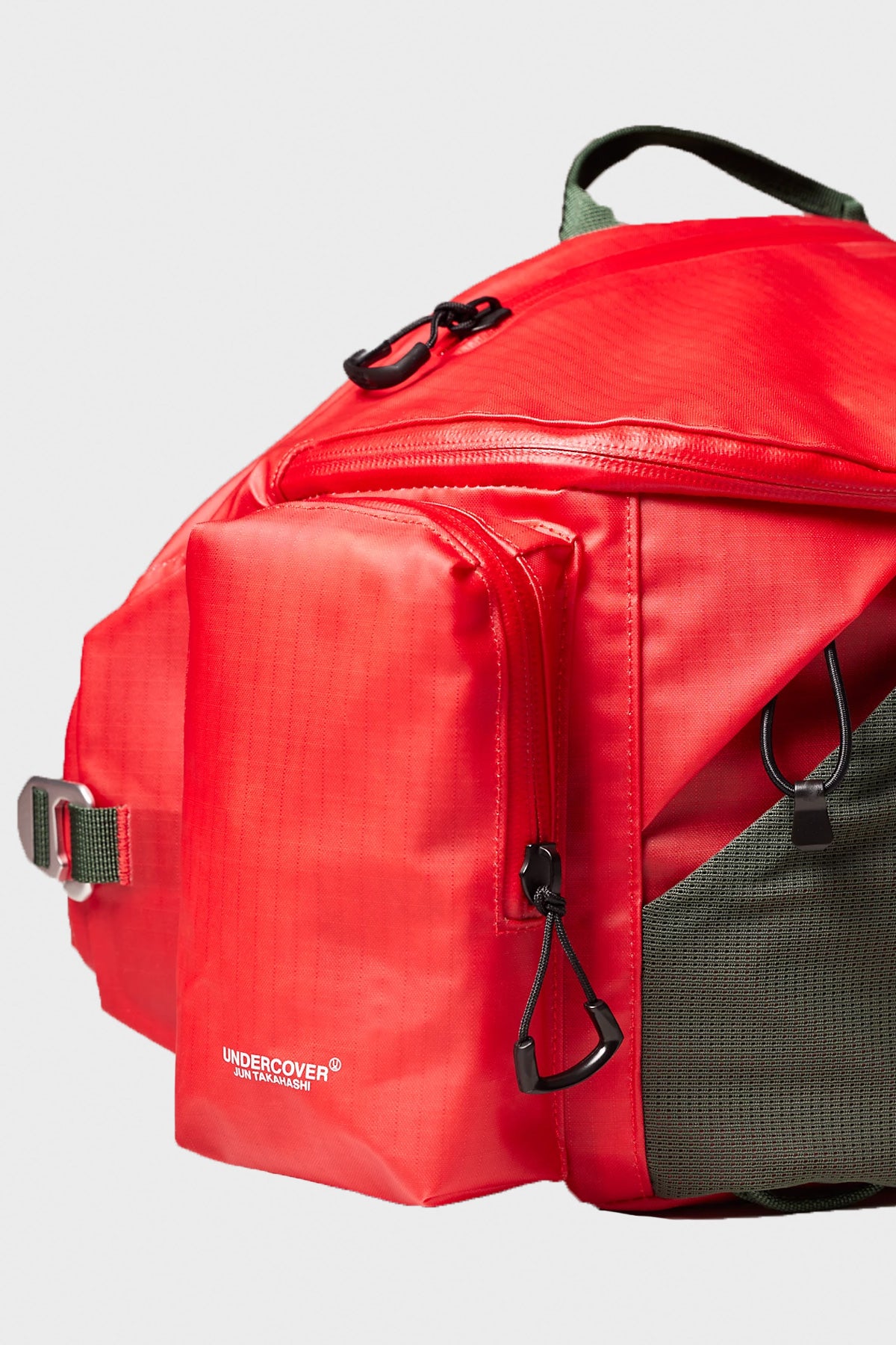 The North Face - TNF x Undercover Soukuu Waistpack - Dark Cedar Green/High Risk Red - Canoe Club