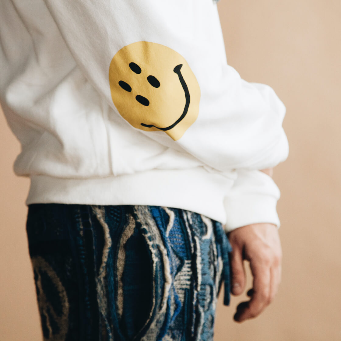 kapital eco jersey smilie sweatshirt and boro gaudy pants on model