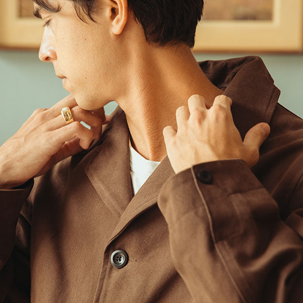 square image of model wearing brown conkers jacket