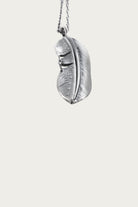 North Works - 25¢ Half Feather Pendant - Canoe Club