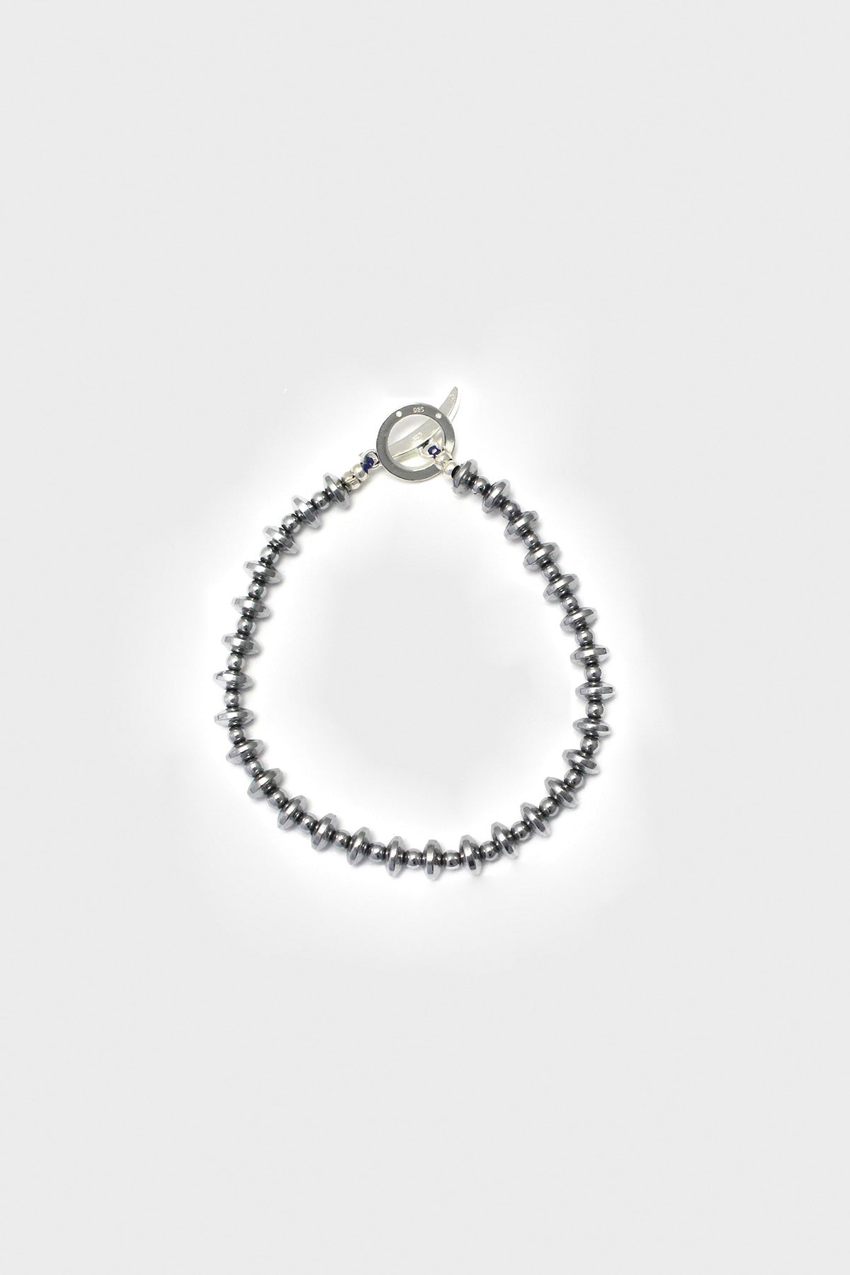 Mikia - Hematite Roundel Stone	Bracelet - Silk/Sterling - Canoe Club