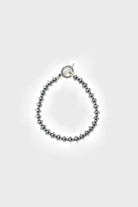 Mikia - Hematite Roundel Stone	Bracelet - Silk/Sterling - Canoe Club