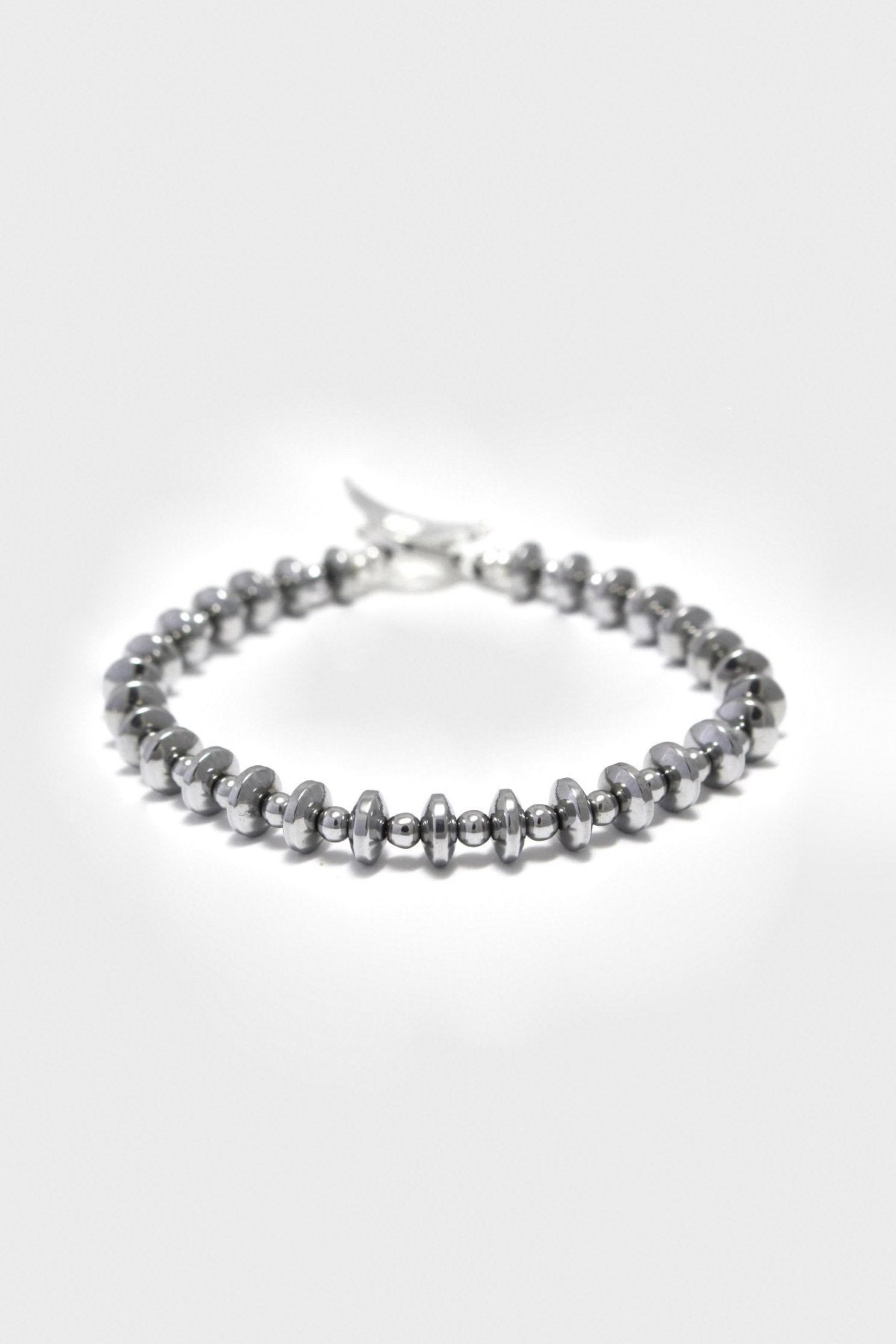 Mikia - Hematite Roundel Stone	Bracelet - Silk/Sterling - Canoe Club