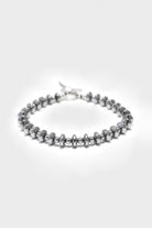 Mikia - Hematite Roundel Stone	Bracelet - Silk/Sterling - Canoe Club